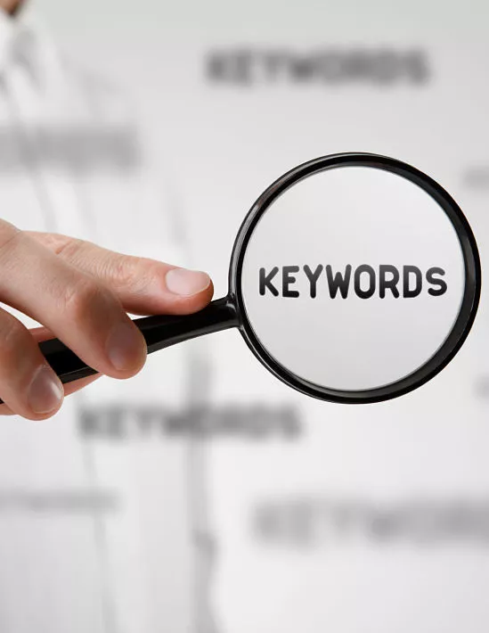 Perfectly Optimized- on-site SEO is essential for the success of a website, keywords under a magnifying glass.
