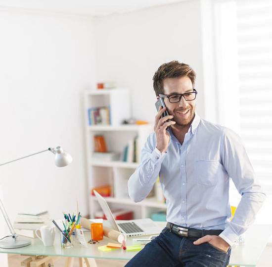 young man at phone at office | Perfectly Optimized
